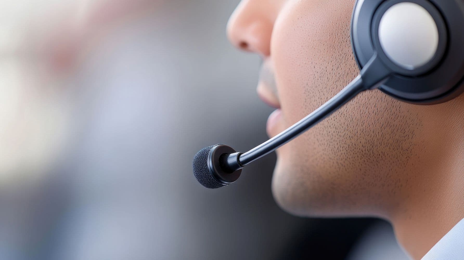 Close-up portrait of an Indian Customer Service Rep in office wearing a headset symbolizing support services
