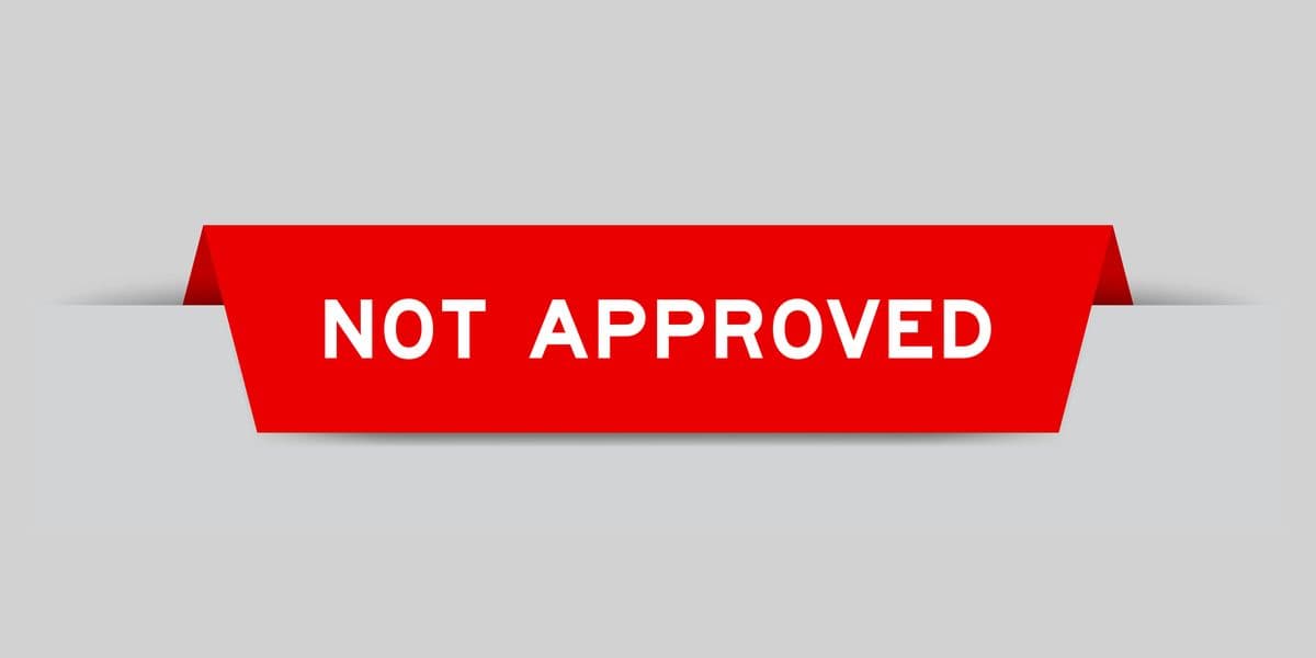 Red color inserted label with word not approved on gray background