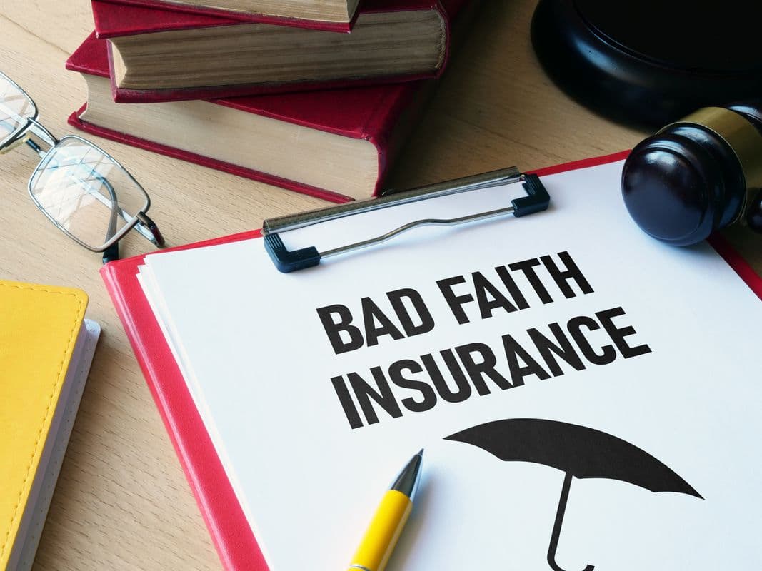 Bad faith insurance is shown using a text on Legal Documents