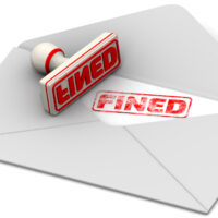 inside of letter that reads stamped caption FINED inside of letter that reads stamped caption FINED