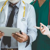 Group of doctor with tablet on white background