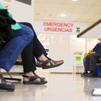 hospital waiting room with people with medical appointment