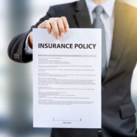 businessman show insurance policy