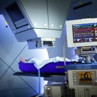 Proton therapy irradiates cancer cells with a beam of protons inside the tumor. Proton therapy irradiates cancer cells with a beam of protons inside the tumor.
