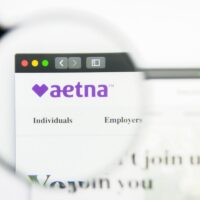 Aetna logo visible on screen.