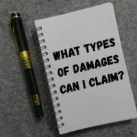 notebook-with-question-about-types-of-damages-to-claim
